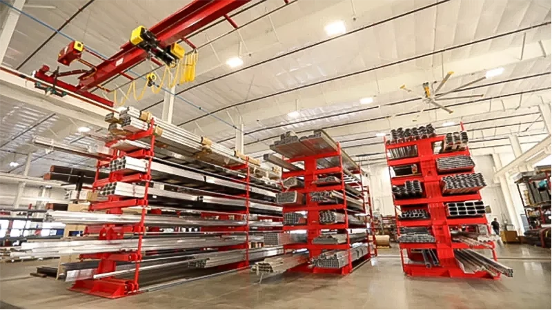 rolling cantilever storage system with overhead crane access