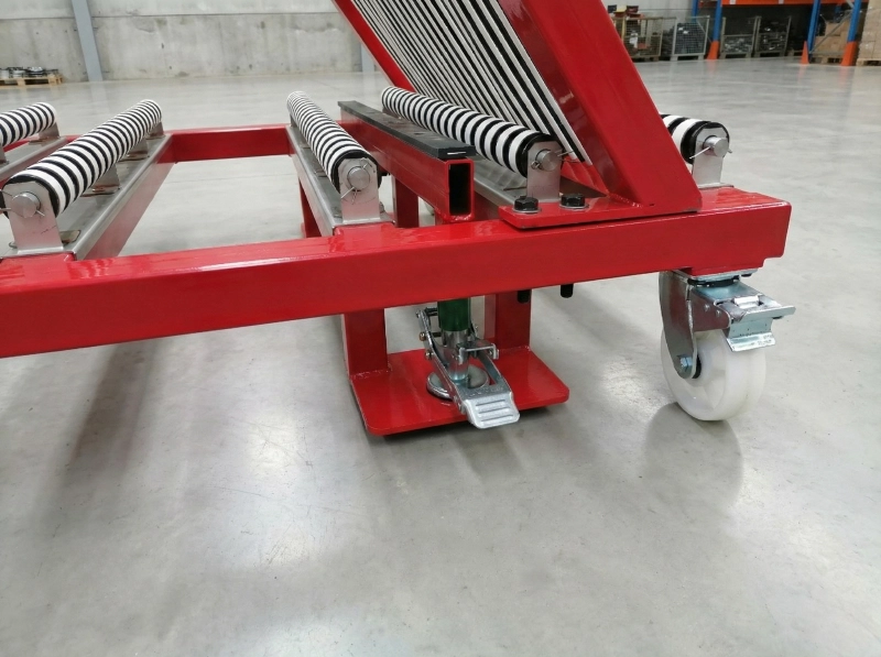 A red PVC covered harp rack for glass in a studio setting.