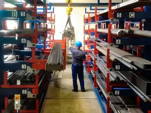 Stop Burning Labor Hours Picking Steel Pipes: How a Roll-Out Cantilever Rack Clears the Outbound Dock