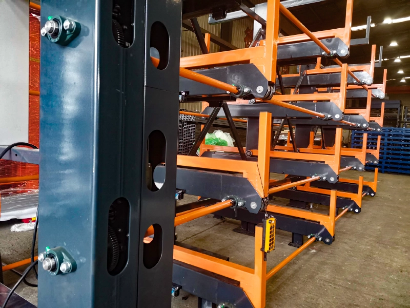 Close-up of Terack rack-and-pinion transmission with orange cantilever arms for smooth scratch-free extension