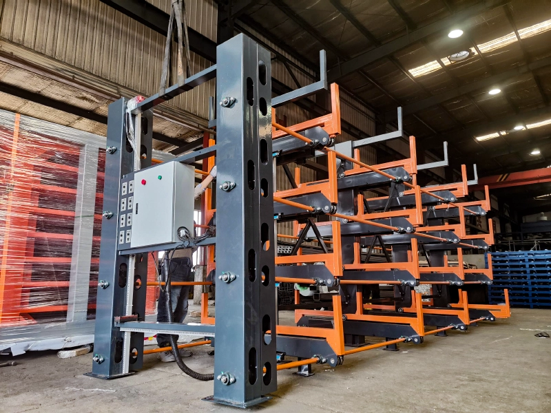 Telescopic cantilever rack with slotted steel columns, roller-supported arms, and control box