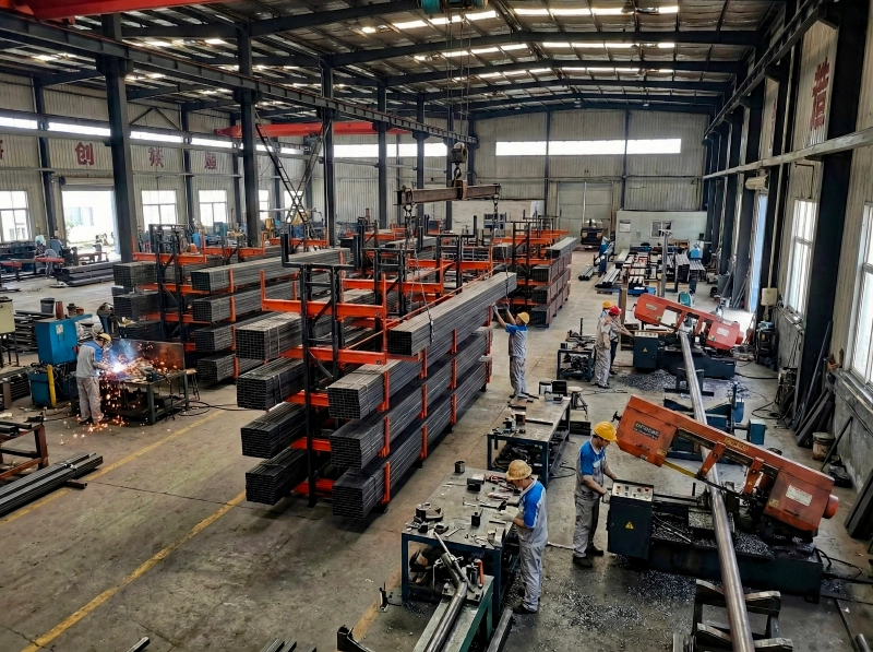 Telescopic cantilever racking system storing long pipes and tubes by diameter in a metal service center