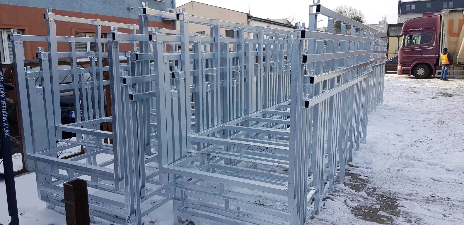 Heavy-duty galvanized steel stackable pallet rack frames with welded tubular uprights