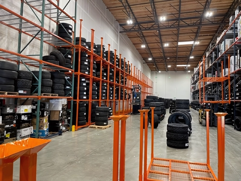 Rows of industrial storage racks in a warehouse aisle
