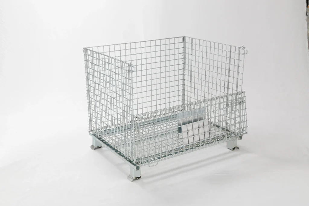 Fully assembled electro-galvanized wire mesh storage cage with half-drop front gate and stackable steel feet.