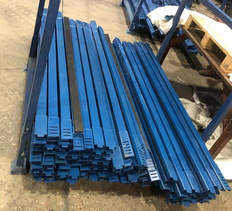 Warehouse photo of a mobile double-sided glass storage rack with casters and forklift handling