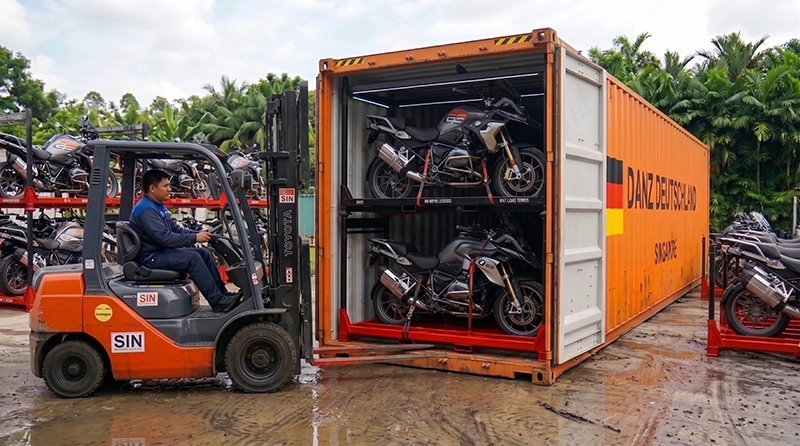 Loading motorcycle rack into shipping container