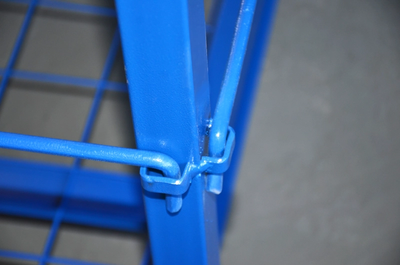 Close-up of bend hook on side protective rod connecting to welded steel slot of square column upright