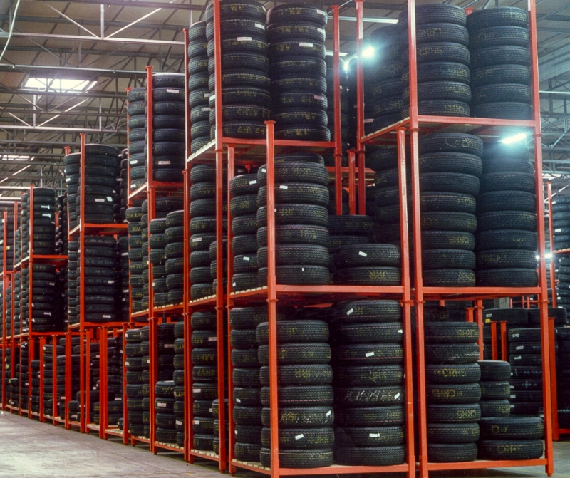 Empty orange storage rack showing posts and base frame