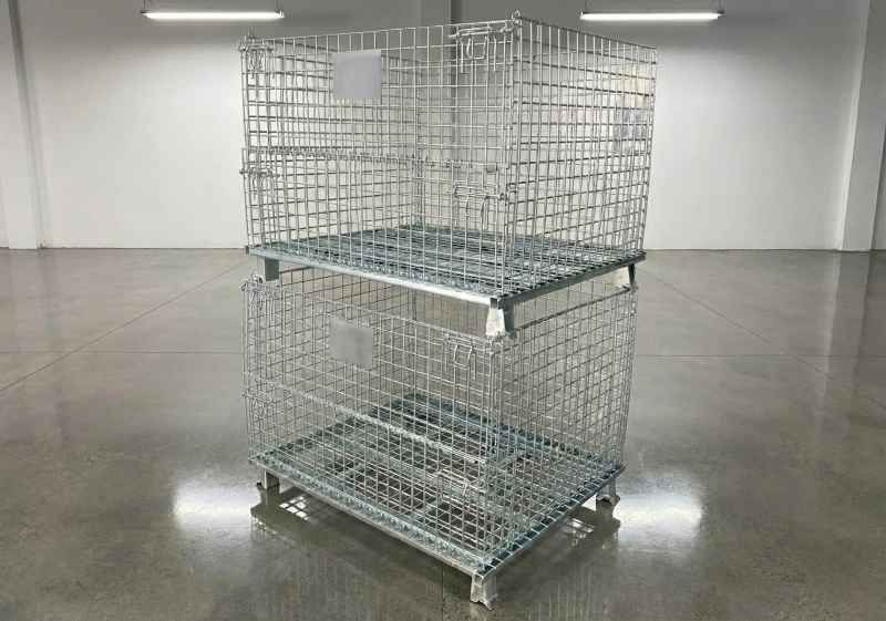 Two assembled wire mesh containers stacked vertically on reflective showroom floor displaying high stability.
