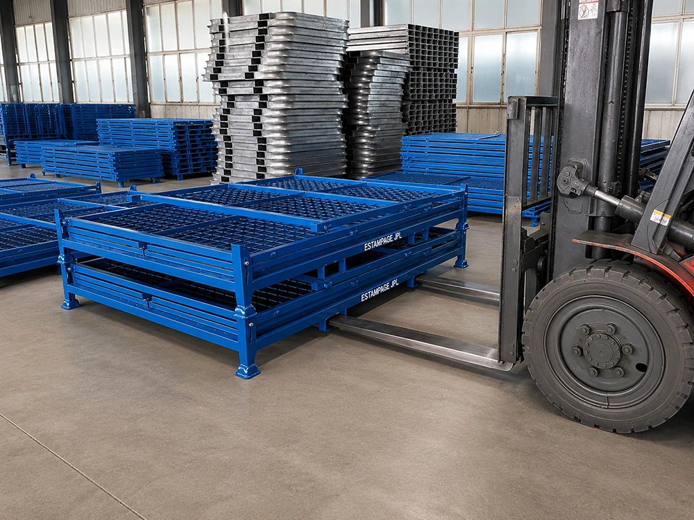 Blue heavy-duty steel stacking stillages with mesh decks being handled by forklift in warehouse