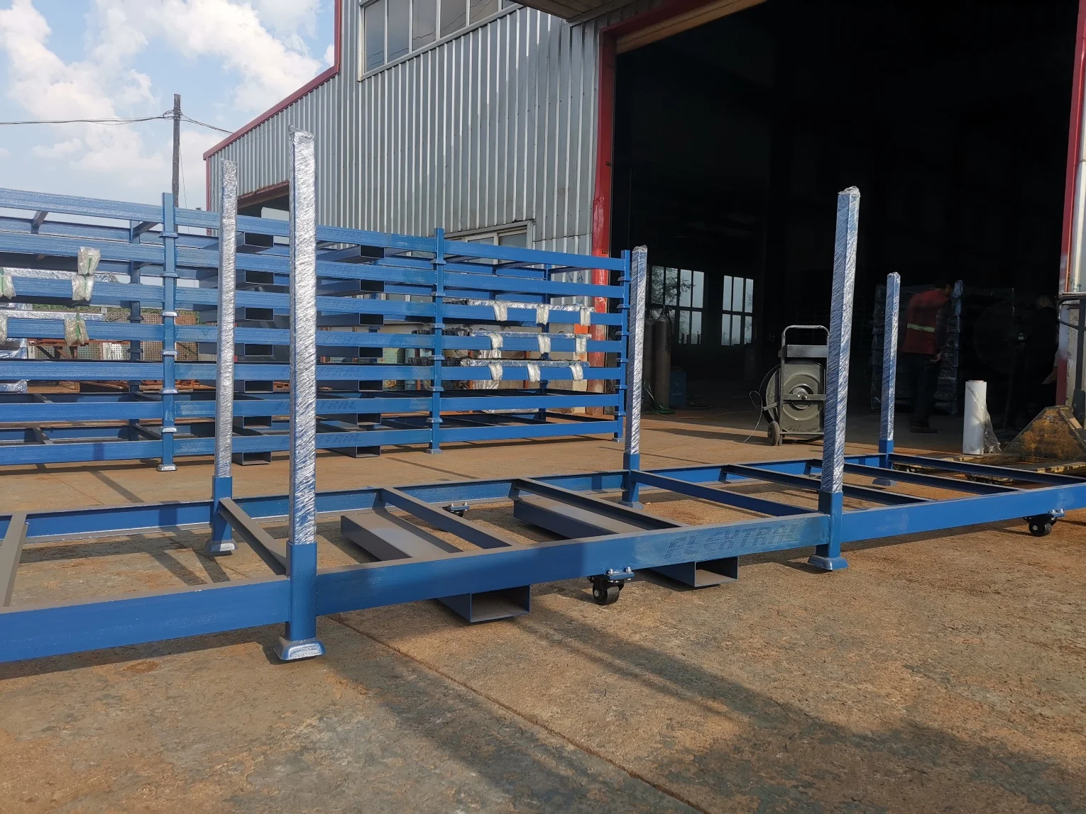 Demountable post pallet holding tires upright in a warehouse